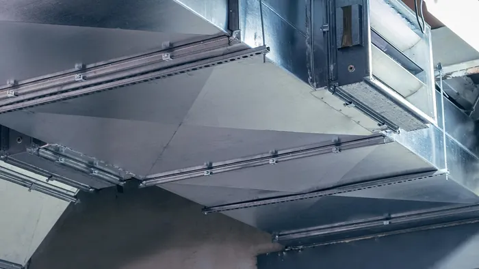 New galvanized sheet-metal ductwork running through a building under construction